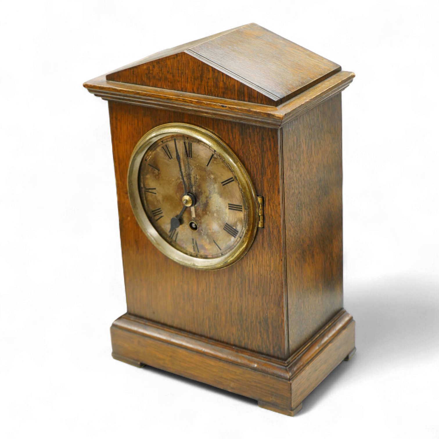 A RAF oak cased Officer's Mess mantel timepiece, with winding key, case key and pendulum, silvered dial engraved with crowned RAF surrounded by laurel insignia, and an 8 day fusee movement by F.W. Elliott, dated 1938, 35
